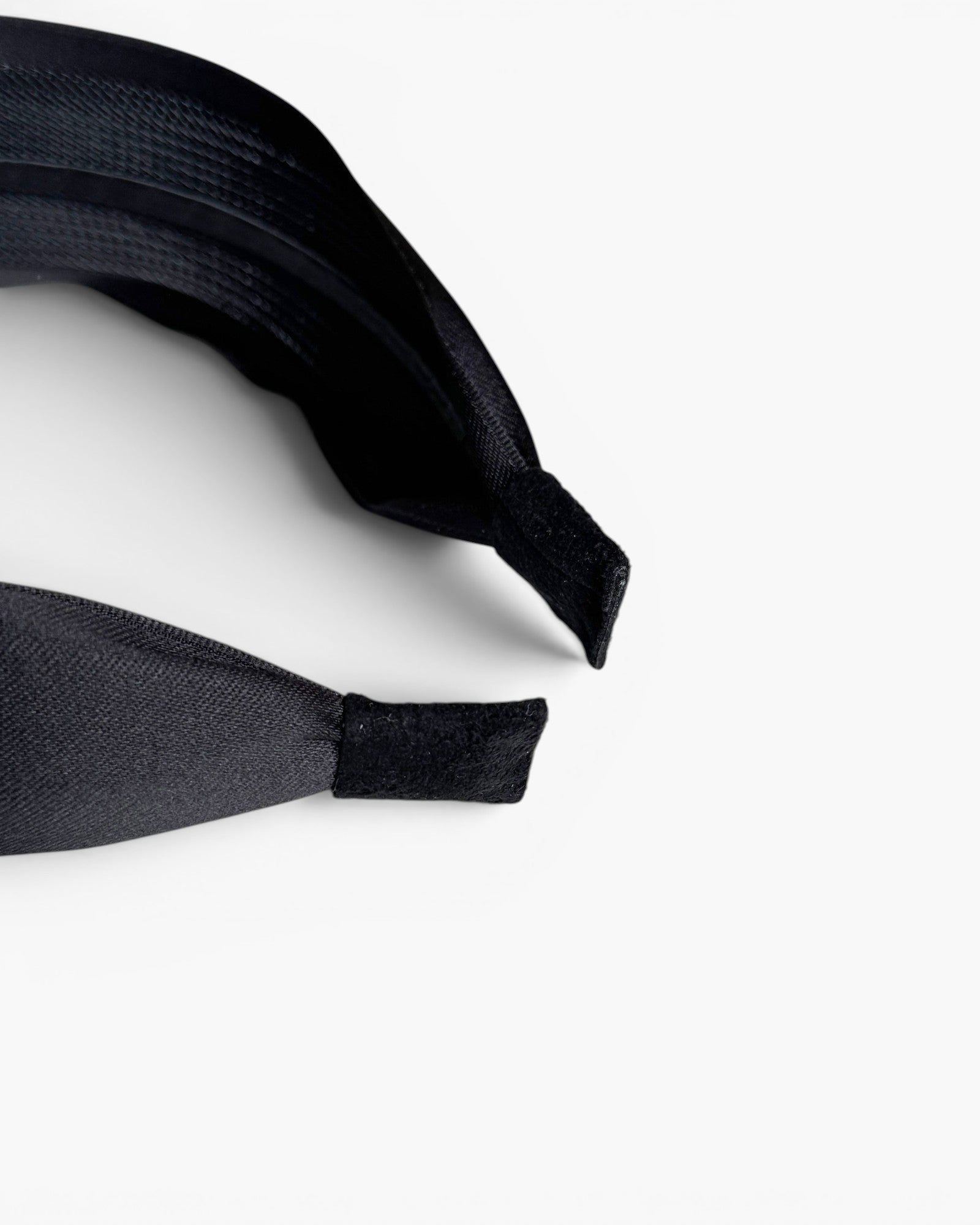 JONES + CO Olivia headband in ebony black with a smooth fabric finish and comfortable suede-tipped ends.