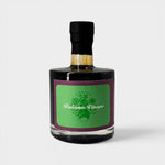 JONES + CO organic balsamic vinegar in a glass bottle with a green label, aged in oak barrels for rich flavor.