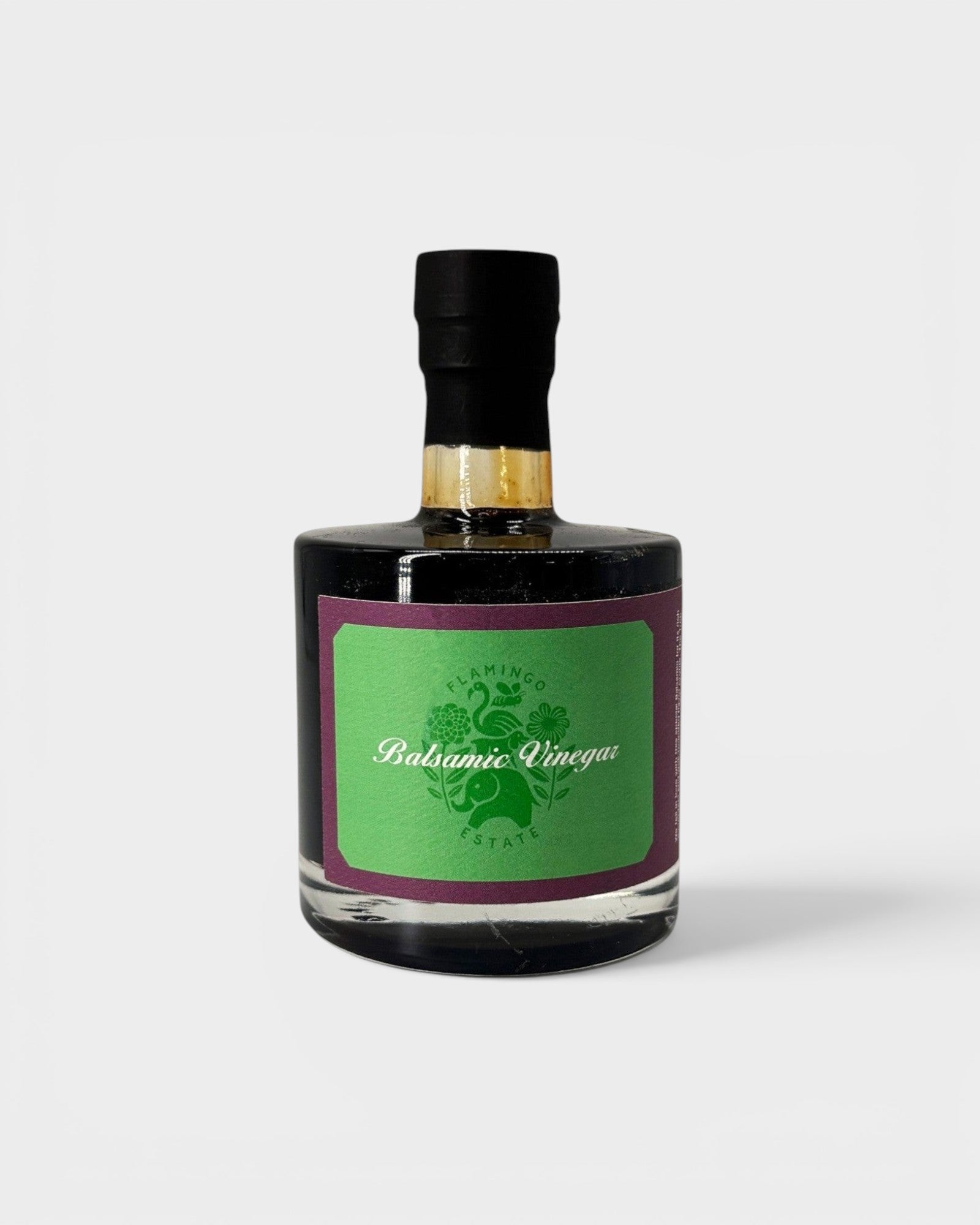 JONES + CO organic balsamic vinegar in a glass bottle with a green label, aged in oak barrels for rich flavor.
