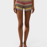 JONES + CO Raya high-rise knit shorts in multi-color stripe with ribbed waistband and zig zag hem on a model.