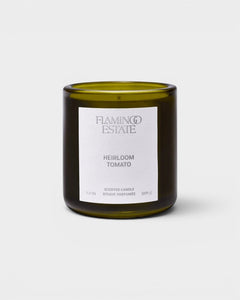 JONES + CO Flamingo Estate Roma Heirloom Tomato scented candle in a dark green glass jar with a white label.