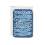 JONES + CO Sardines greeting card with blue fish illustration and We're In This Together text on recycled paper.