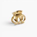 JONES + CO Selene gold stainless steel claw clip with elegant curved lines for a sophisticated hair accessory look.