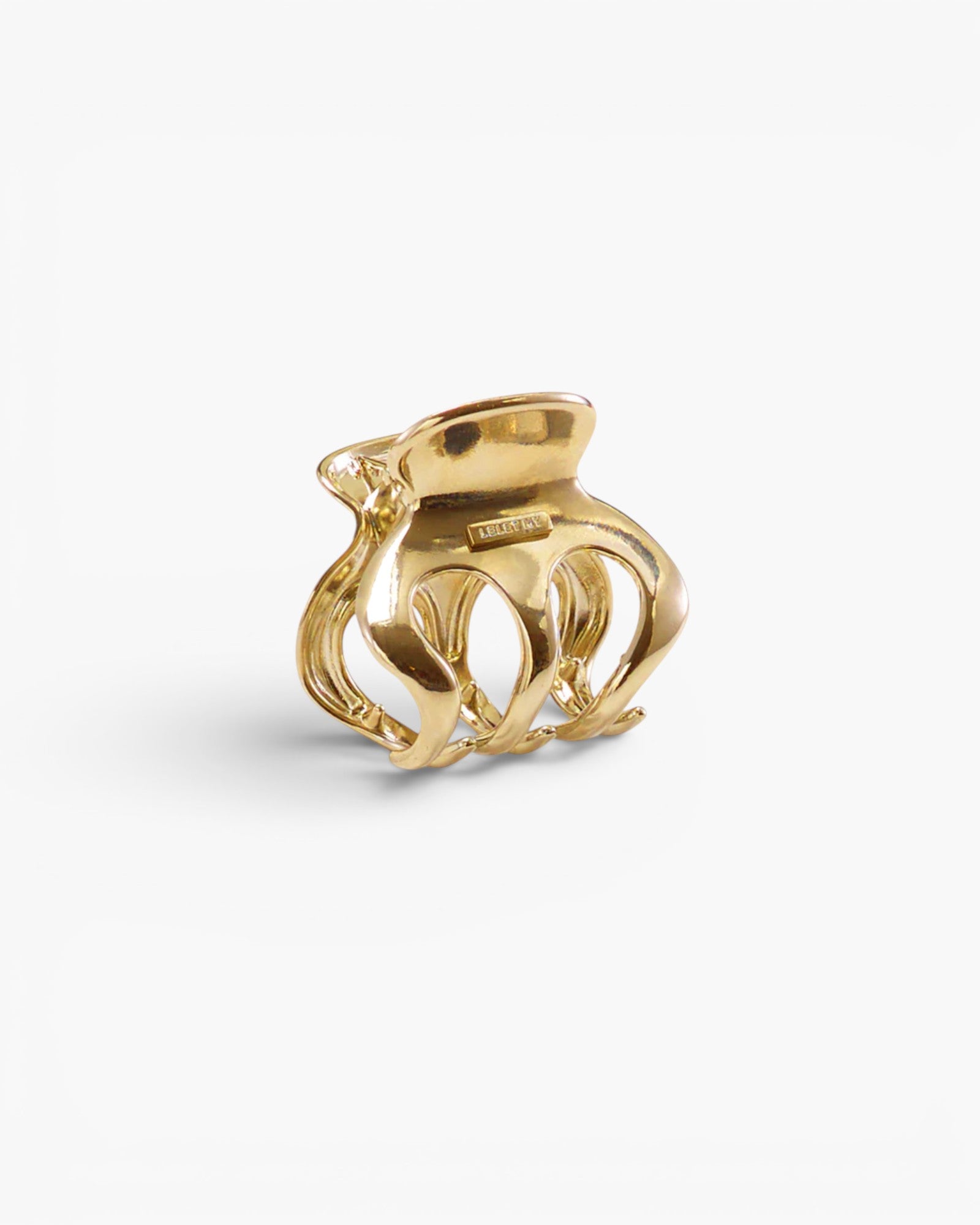 JONES + CO Selene gold stainless steel claw clip with elegant curved lines for a sophisticated hair accessory look.