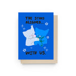 JONES + CO The Stars Aligned greeting card featuring two cute cats hugging on a blue background with star illustrations.