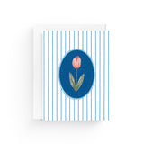 JONES + CO Striped Tulip greeting card on recycled paper with a blue oval frame and white envelope.