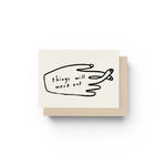 JONES + CO greeting card with a black line drawing of fingers crossed and the text Things Will Work Out.