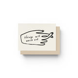 JONES + CO greeting card with a black line drawing of fingers crossed and the text Things Will Work Out.