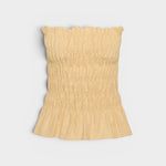 JONES + CO Tiera strapless linen top in daffodil yellow with shirred bodice, frilled neckline, and peplum hem.