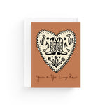 JONES + CO greeting card with a heart, cowboy boots, and flowers on recycled paper with a white envelope.