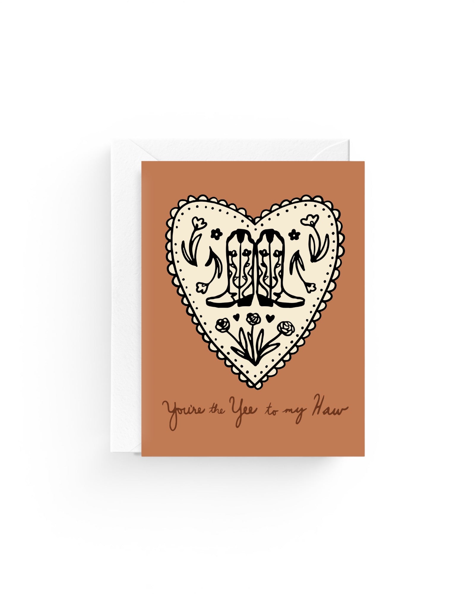 JONES + CO greeting card with a heart, cowboy boots, and flowers on recycled paper with a white envelope.