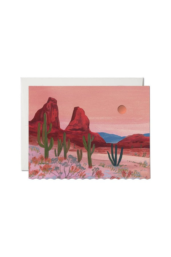 JONES + CO Zion greeting card featuring a desert landscape illustration by Becca Stadtlander with red rock formations.