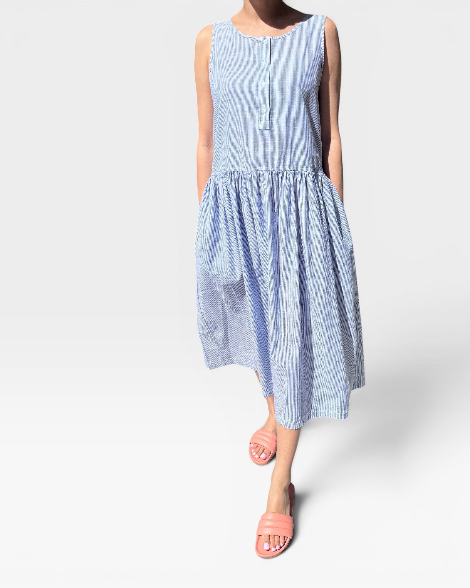 Light blue dress worn by a person on a white background