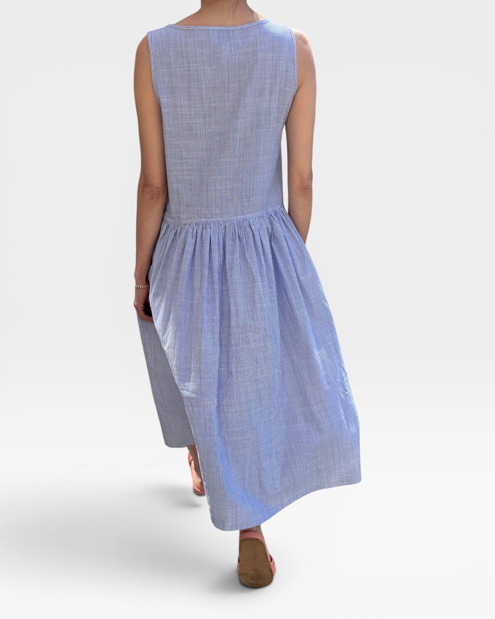 Blue striped dress worn by a model on a white background