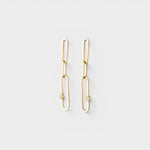 JONES + CO 14K gold paper clip dangle earrings featuring delicate diamond accents on a minimalist chain design.