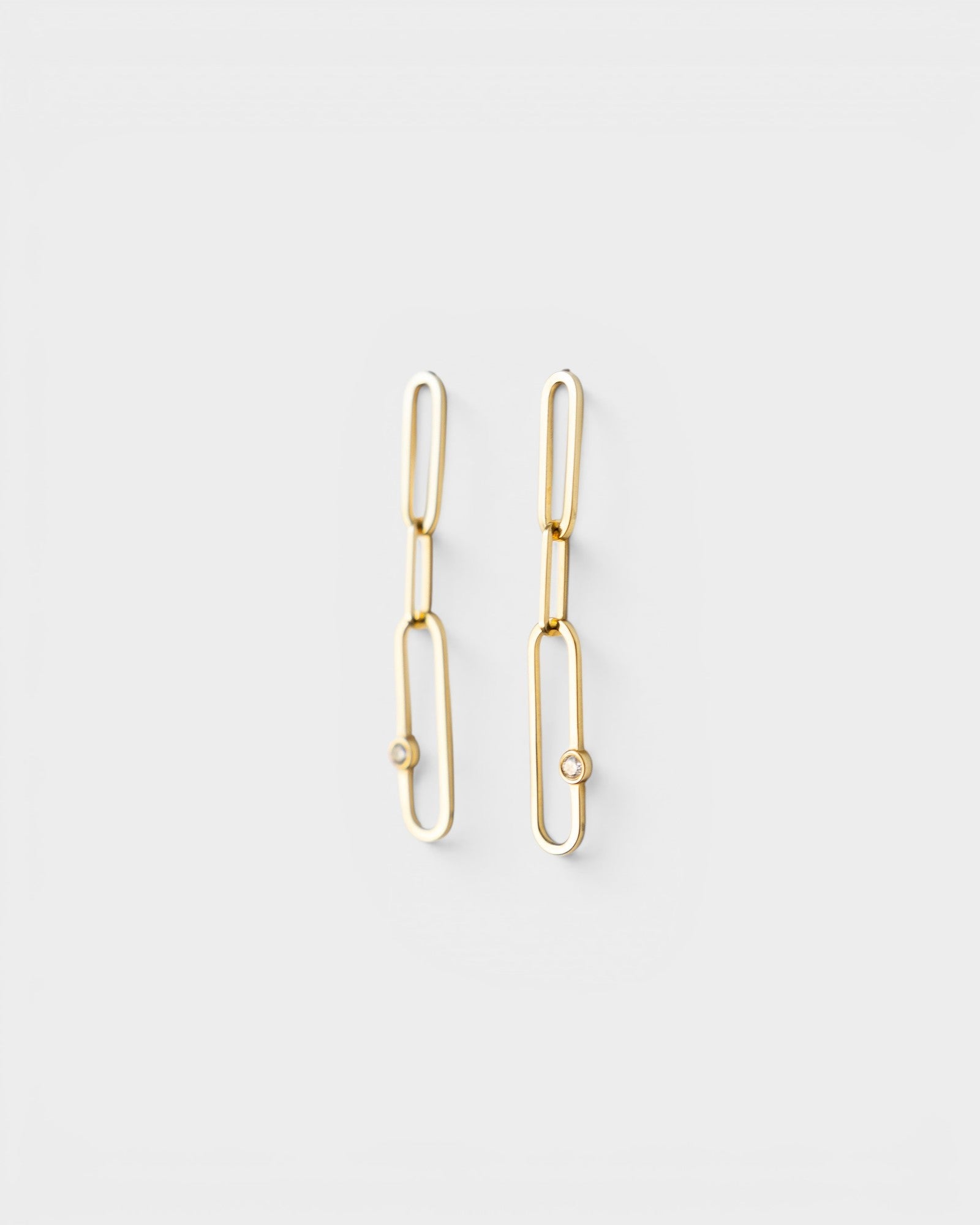 JONES + CO 14K gold paper clip dangle earrings featuring delicate diamond accents on a minimalist chain design.