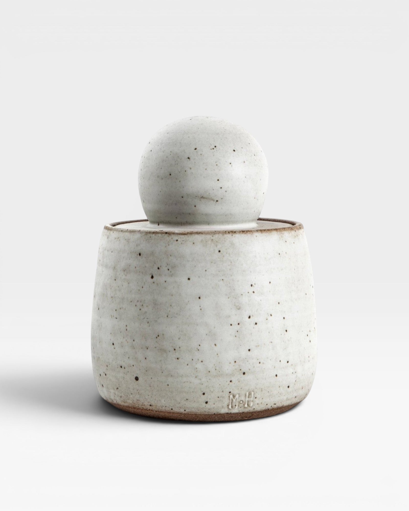 JONES + CO alabaster matte glaze stoneware stash jar with chunky knob lid. Handmade speckled ceramic.