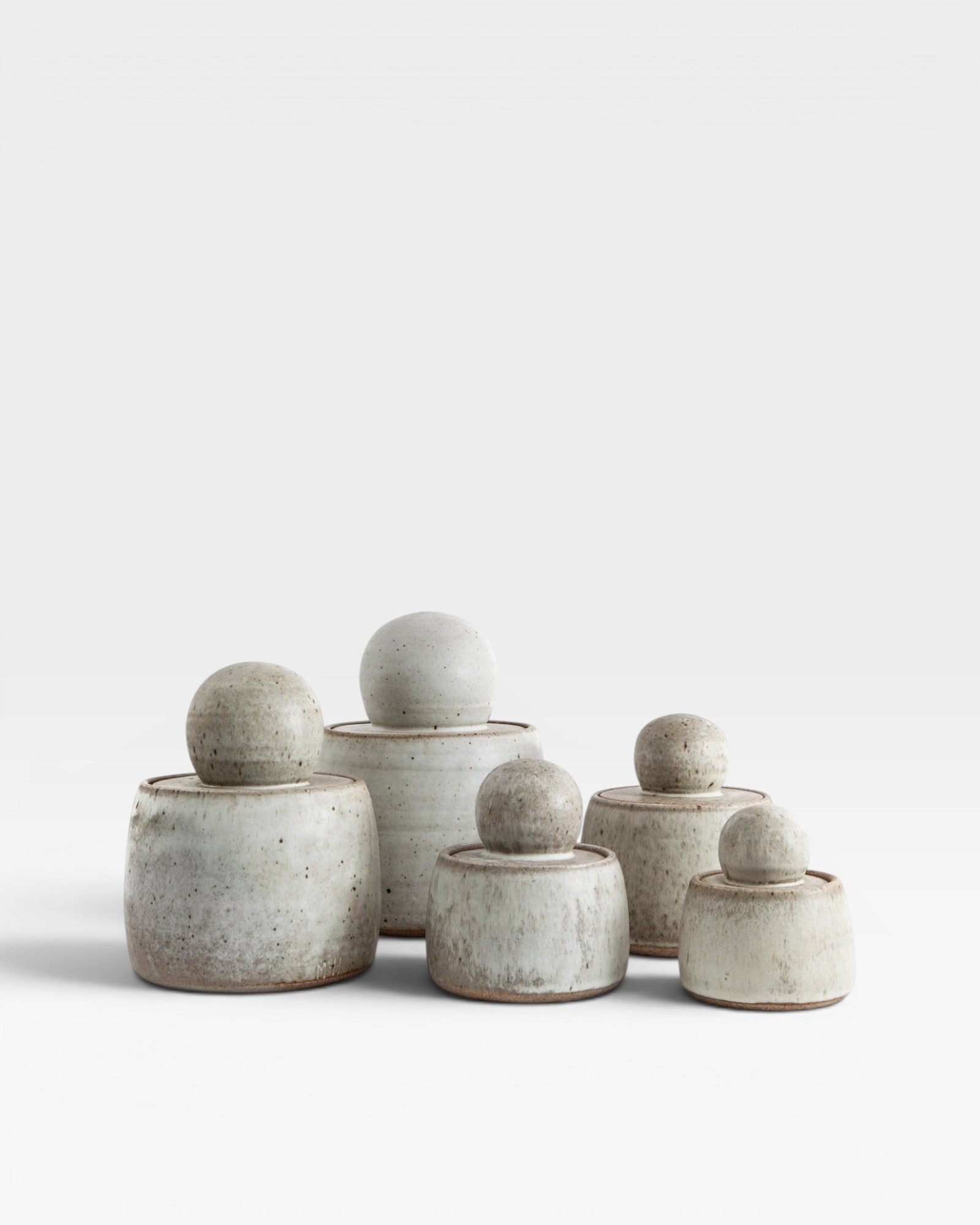 JONES + CO hand-thrown alabaster stoneware stash jars with matte glaze and chunky knobs. Set of 6.