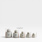 JONES + CO alabaster stoneware stash jars with chunky knobs, shown in 5 sizes from 4" to 10".