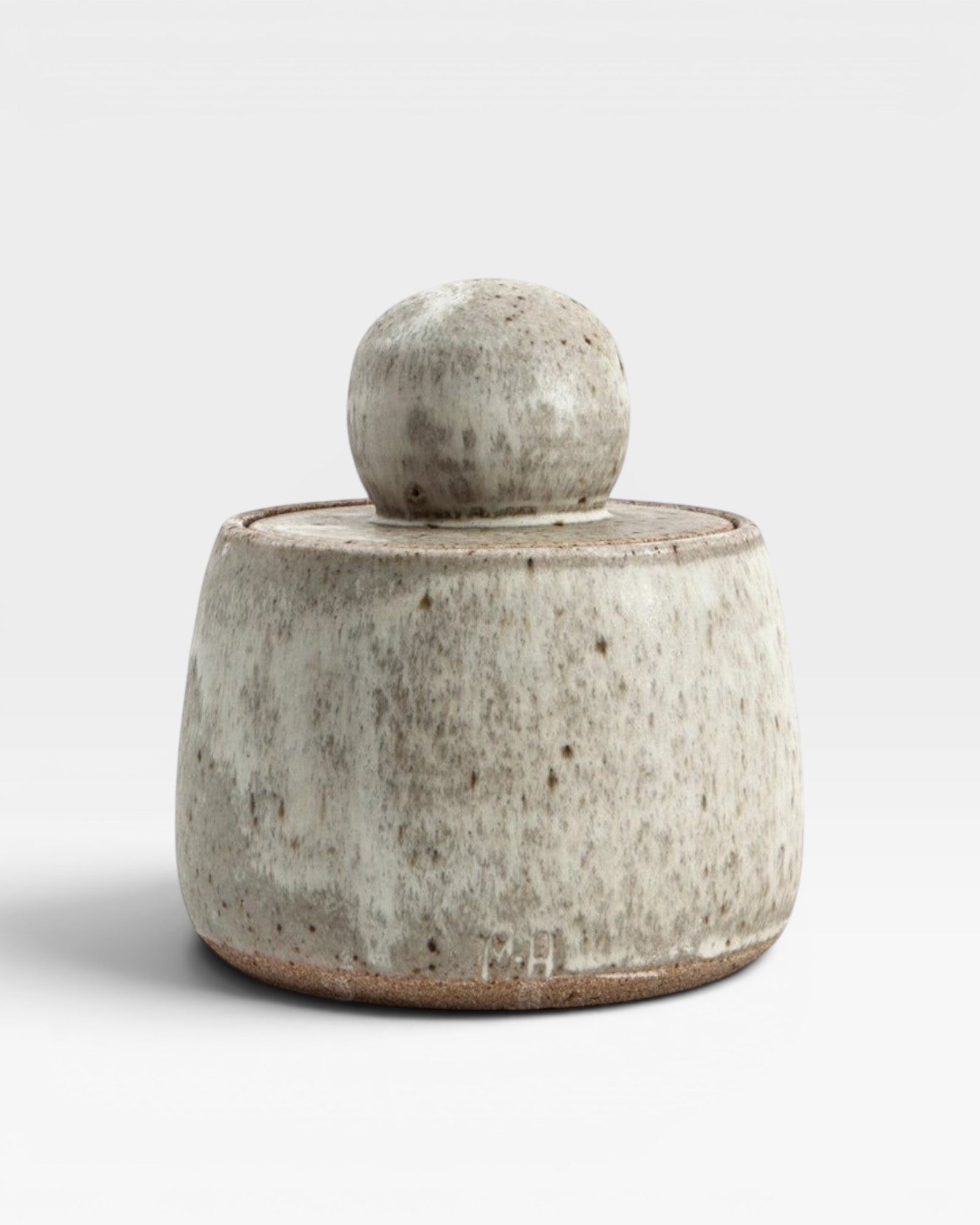 JONES + CO hand-thrown alabaster stoneware stash jar with a matte glaze and chunky knob lid.