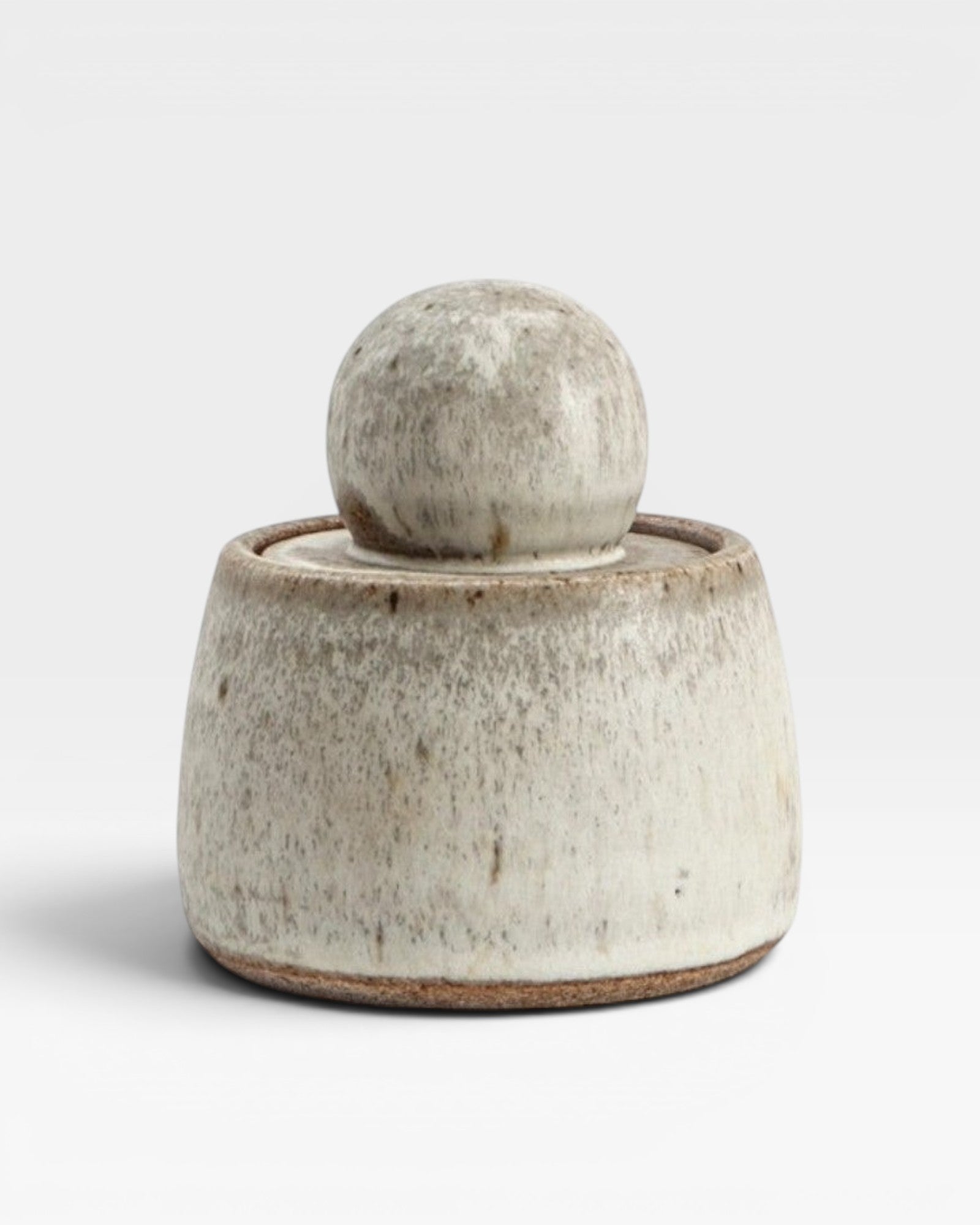 JONES + CO alabaster stoneware stash jar with a chunky knob lid and matte glaze finish.