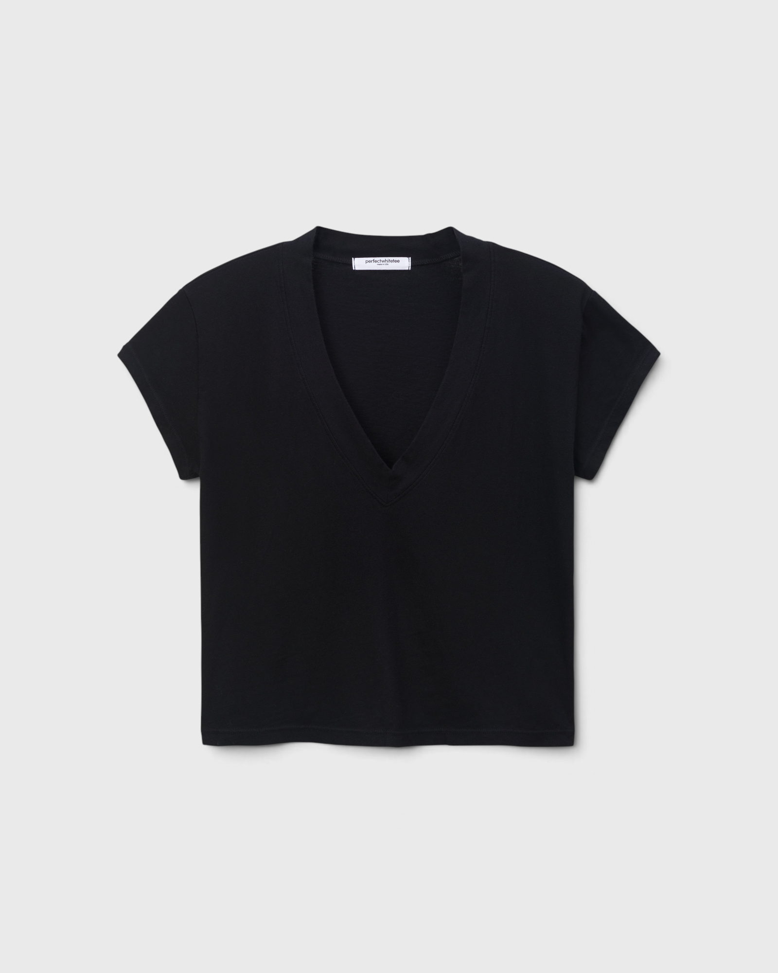 JONES + CO Alanis V-neck t-shirt in true black recycled cotton with a relaxed cropped silhouette.