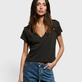 Model wearing a JONES + CO vintage black recycled cotton Alanis V-neck tee with a relaxed cropped fit.
