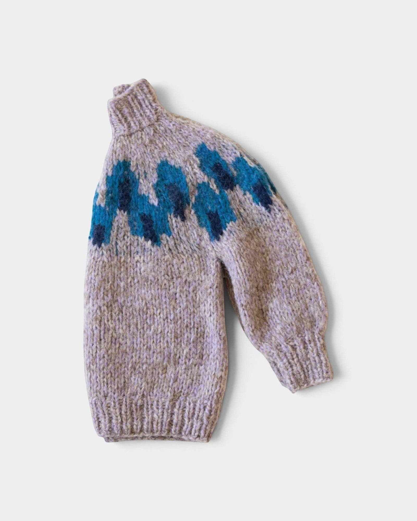 JONES + CO chunky superfine alpaca raglan pullover in light grey with a blue peacock intarsia knit pattern