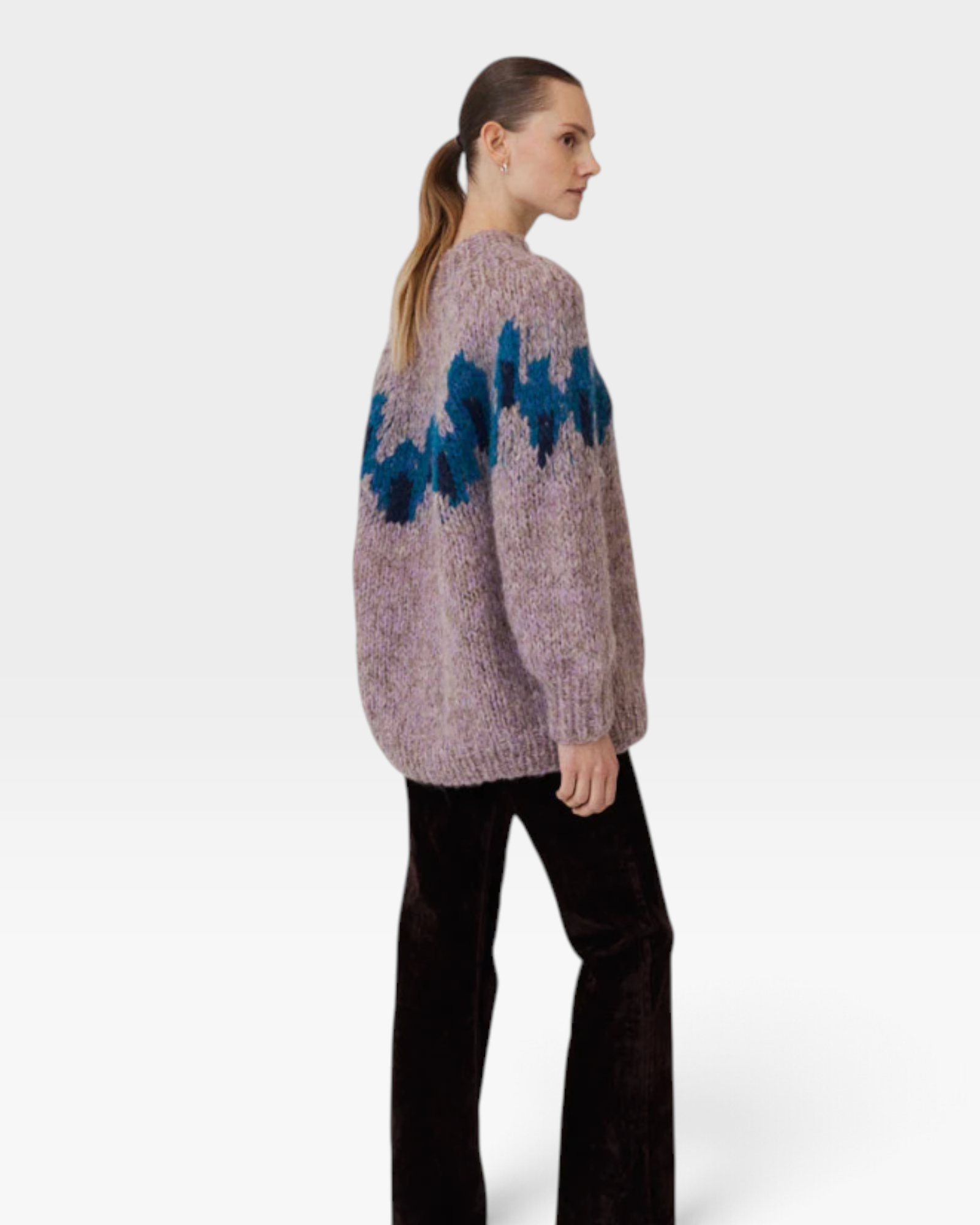 JONES + CO fleecy alpaca blend raglan pullover in lavender with a blue graphic intarsia pattern on the upper body.