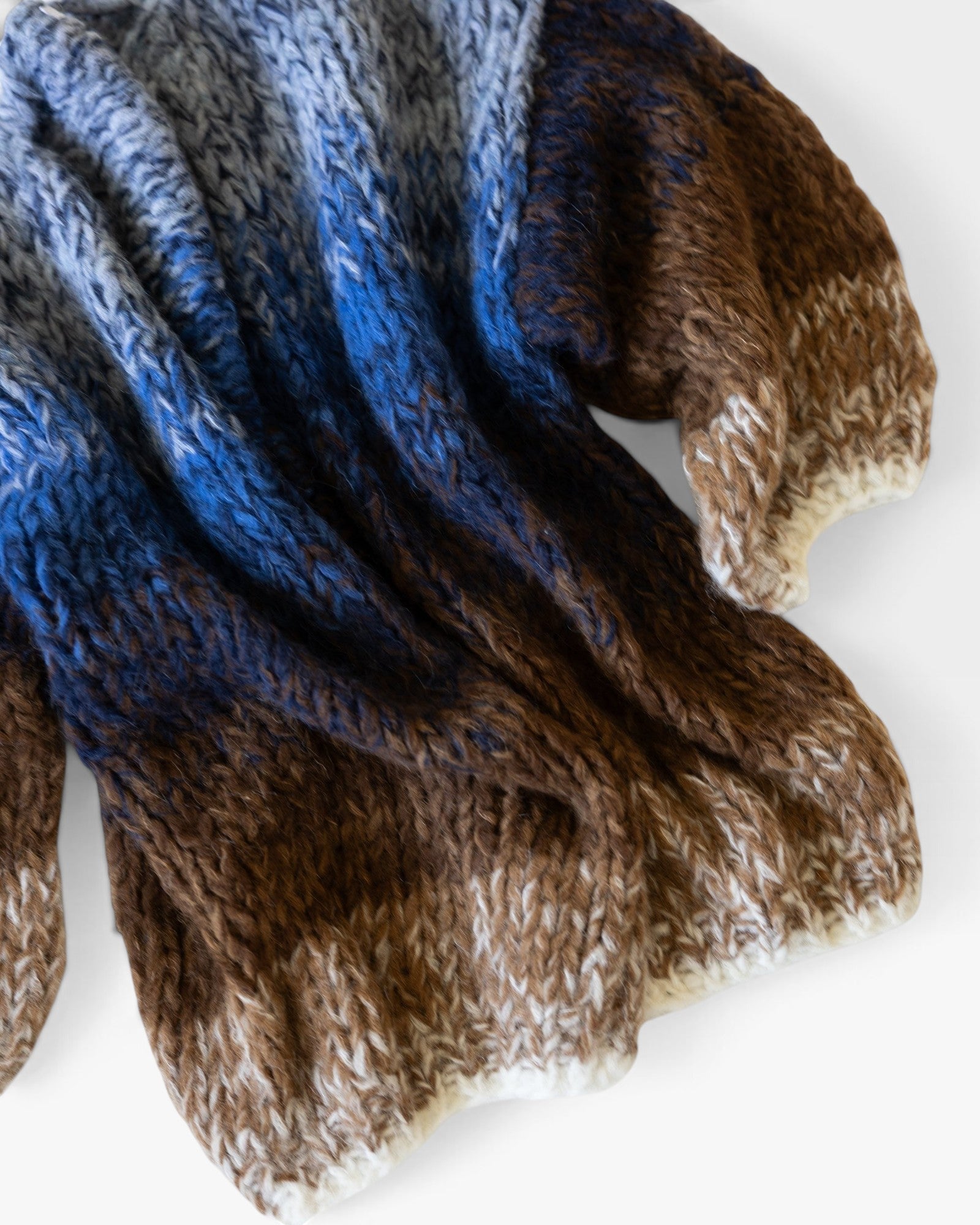 JONES + CO oversized alpaca cardigan in a kingfisher blue and brown ombre knit with a soft, textured finish.