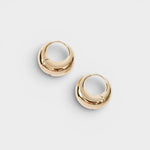 JONES + CO Alpha Hoop small chunky tapered huggie earrings in 12k gold-plated brass with hinge detail.