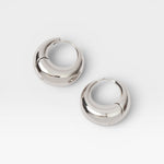 JONES + CO Alpha Hoop small chunky tapered huggie earrings in sterling silver-plated brass with hinge detail.