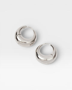 JONES + CO Alpha Hoop small chunky tapered huggie earrings in sterling silver-plated brass with hinge detail.
