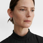 JONES + CO Alpha Hoop small chunky tapered huggie earrings in sterling silver-plated brass.
