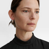 JONES + CO Alpha Hoop small chunky tapered huggie earrings in sterling silver-plated brass.