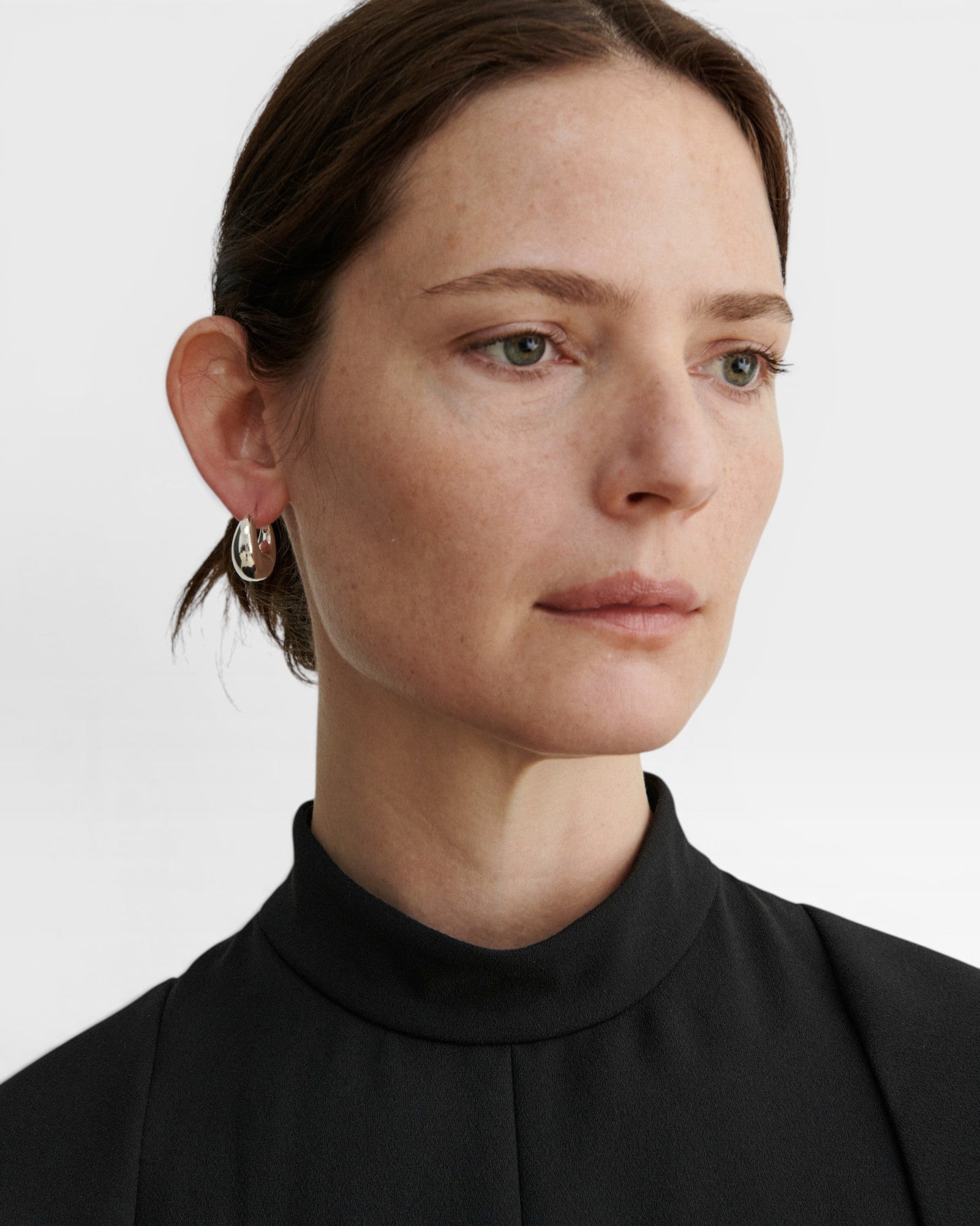JONES + CO Alpha Hoop small chunky tapered huggie earrings in sterling silver-plated brass.