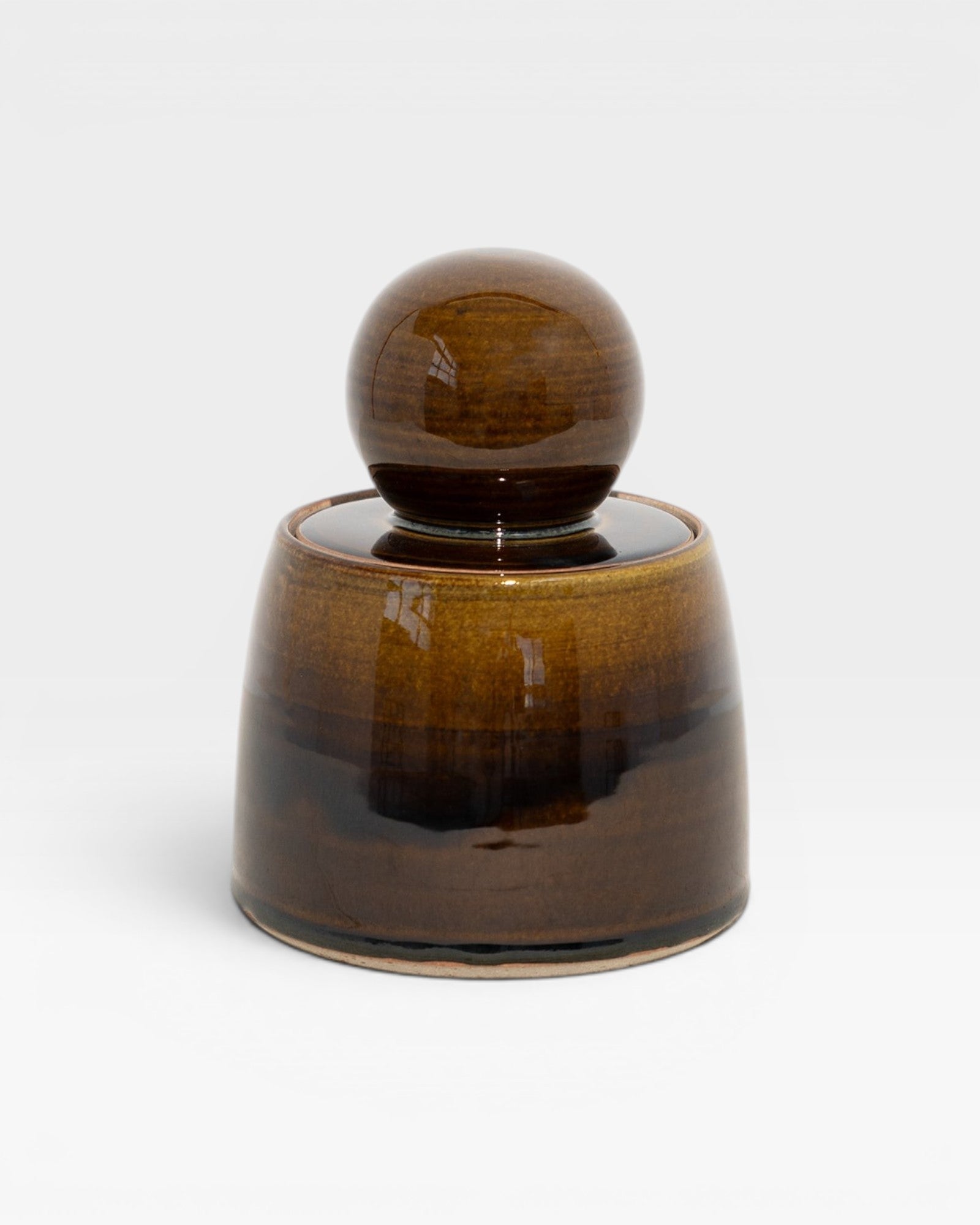 JONES + CO hand-thrown amber stoneware stash jar with a chunky knob and satin glaze. Perfect for organization.
