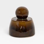 JONES + CO amber glazed stoneware stash jar with a chunky knob. Hand-thrown in Los Angeles.