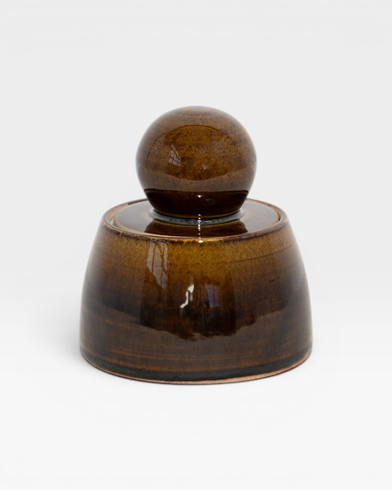 JONES + CO amber glazed stoneware stash jar with a chunky knob. Hand-thrown in Los Angeles.