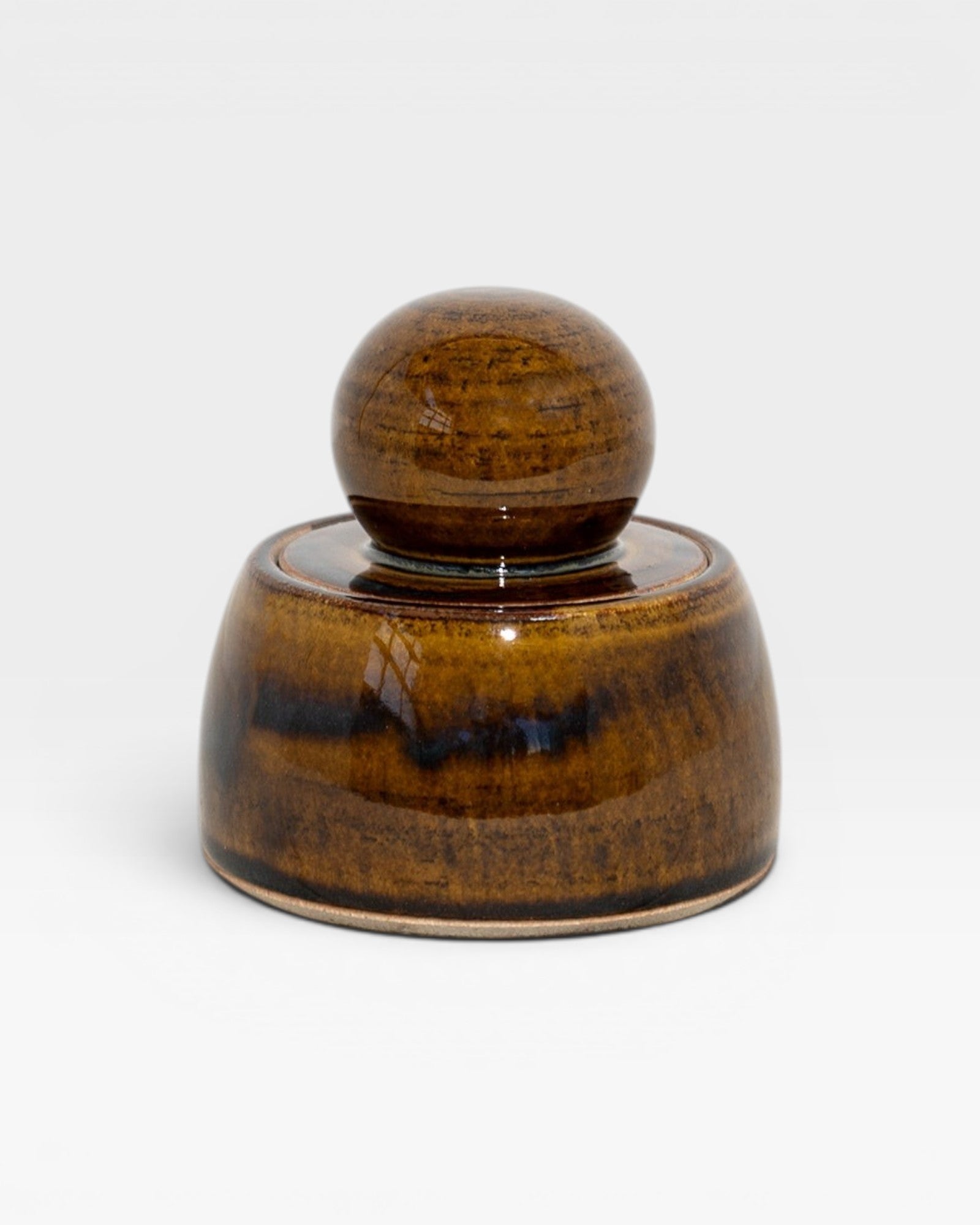 JONES + CO hand-thrown amber stoneware stash jar with a chunky knob and satin glaze.