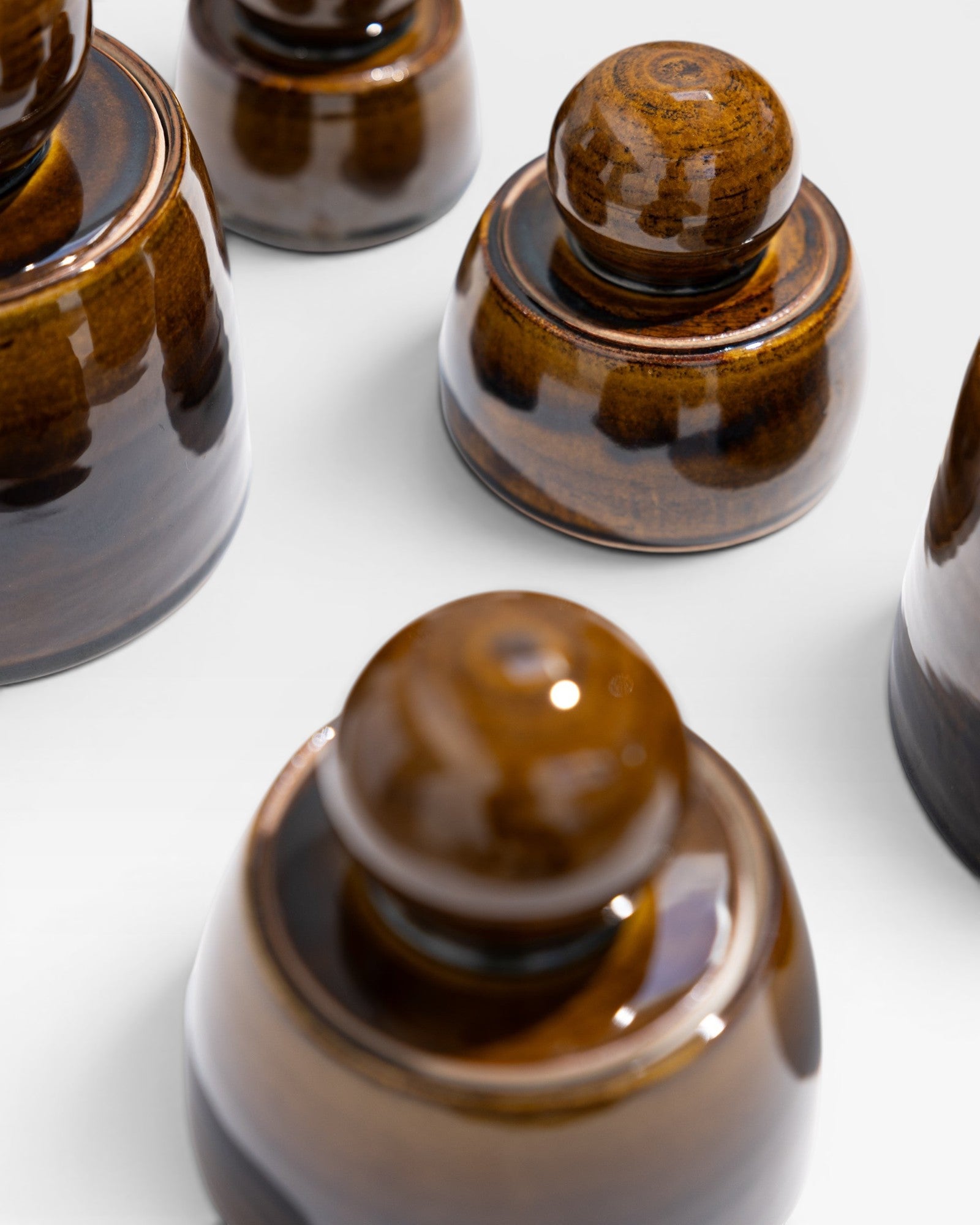 JONES + CO amber stoneware stash jar with chunky knob and satin glaze, hand-thrown in Los Angeles.