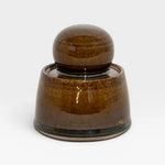 JONES + CO hand-thrown stoneware stash jar with chunky knob, in deep olive green and brown satin glaze.