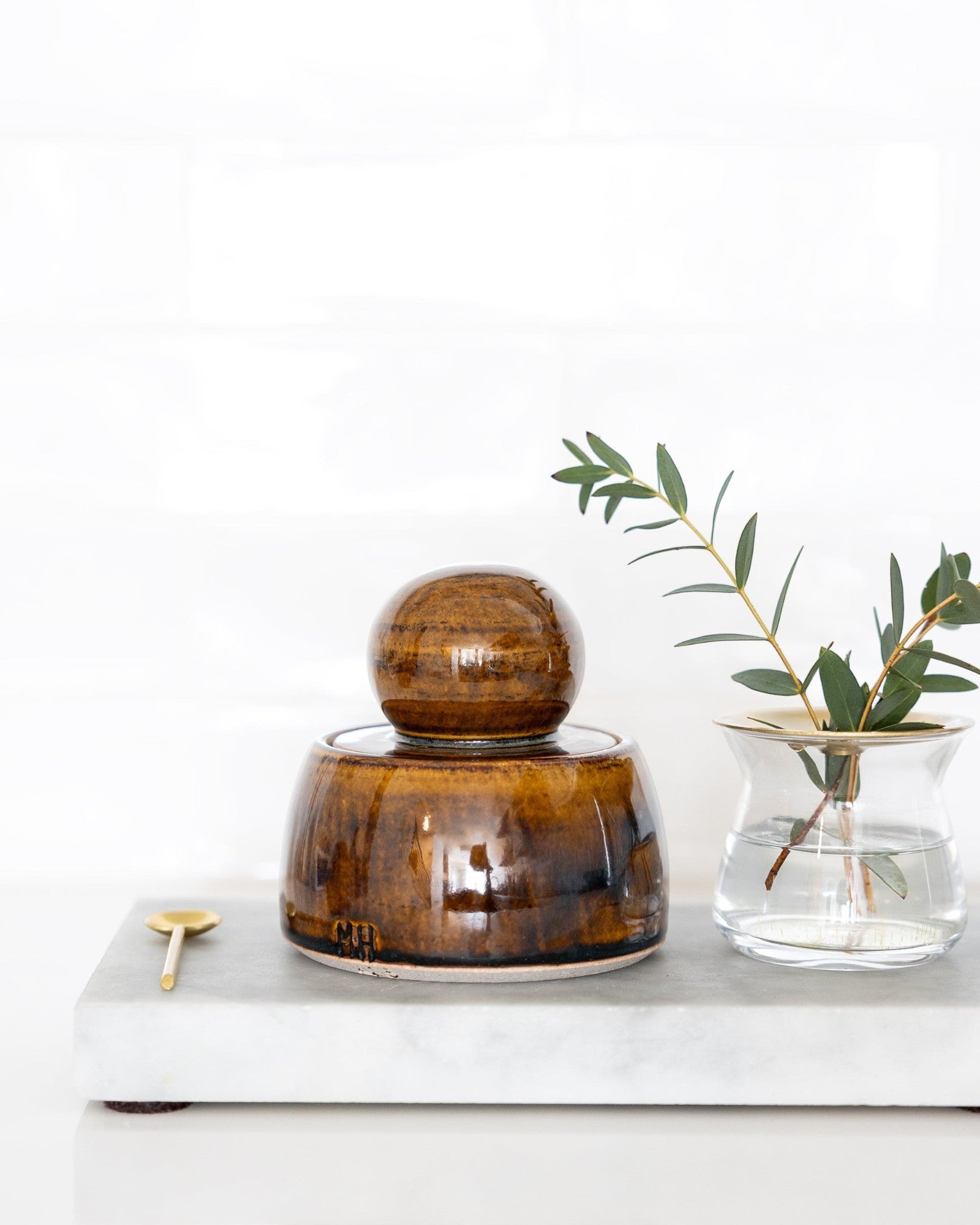 JONES + CO amber stoneware stash jar with chunky knob and satin glaze, hand-thrown in Los Angeles.