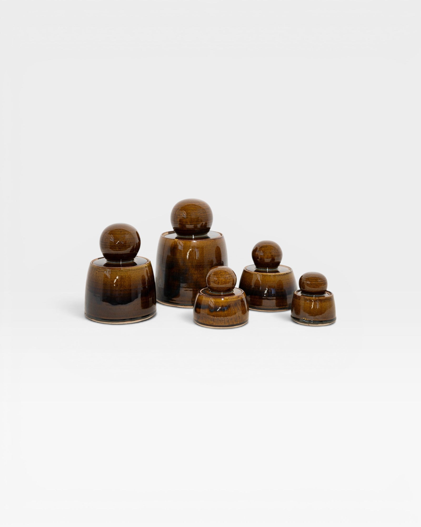 JONES + CO hand-thrown amber stoneware stash jars with chunky knobs and satin glaze. Set of 5.