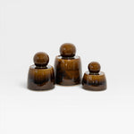 JONES + CO hand-thrown stoneware stash jars in amber with chunky knobs and satin glaze. Set of 3.