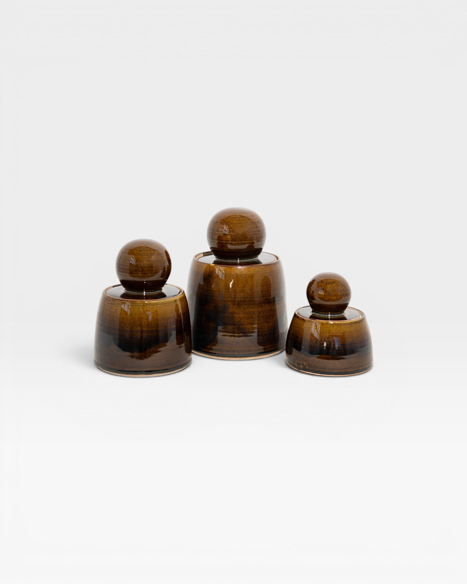 JONES + CO hand-thrown stoneware stash jars in amber with chunky knobs and satin glaze. Set of 3.