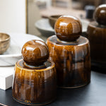 JONES + CO hand-thrown amber stoneware stash jar with chunky knob and satin glaze.