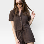 JONES + CO Anais Linen Shirt in chestnut brown. Short-sleeve, button-down, cropped linen shirt with a relaxed fit.