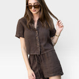 JONES + CO Anais Linen Shirt in chestnut brown. Short-sleeve, button-down, cropped linen shirt with a relaxed fit.