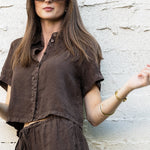 JONES + CO Anais Linen Shirt in chestnut brown. Short-sleeve, button-down, cropped linen shirt with a relaxed fit.